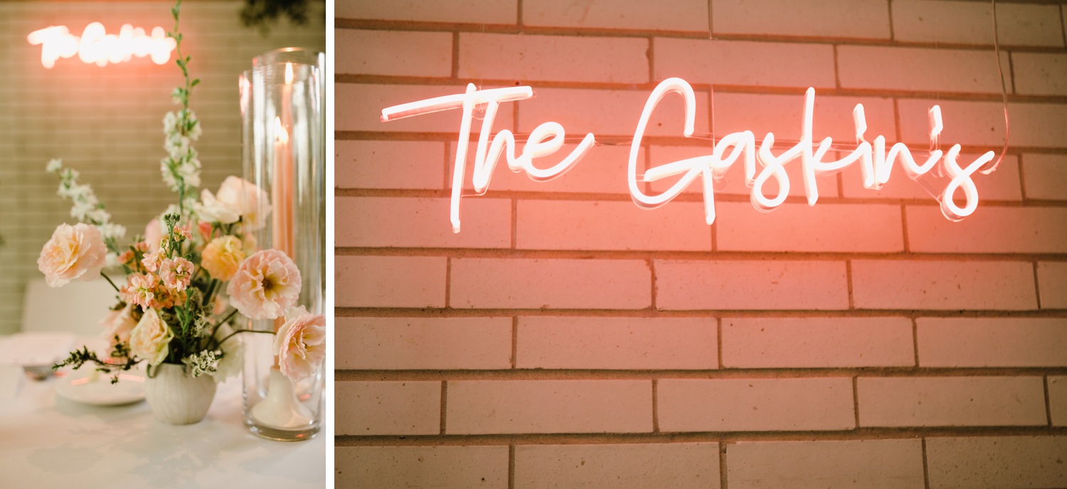 Pink neon sign of the couple's last name at their wedding reception