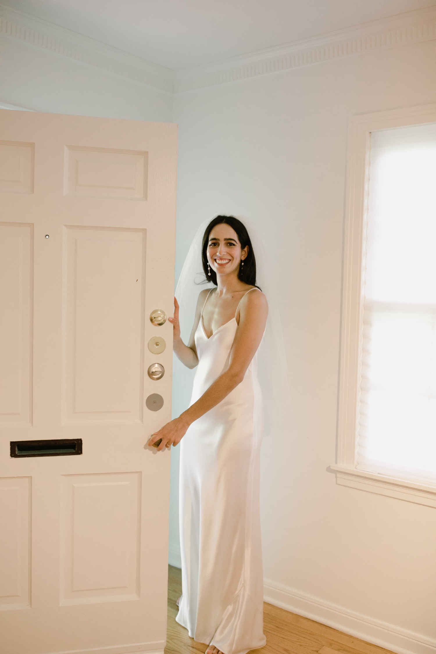 Bride in an ivory slip dress by Galvan London