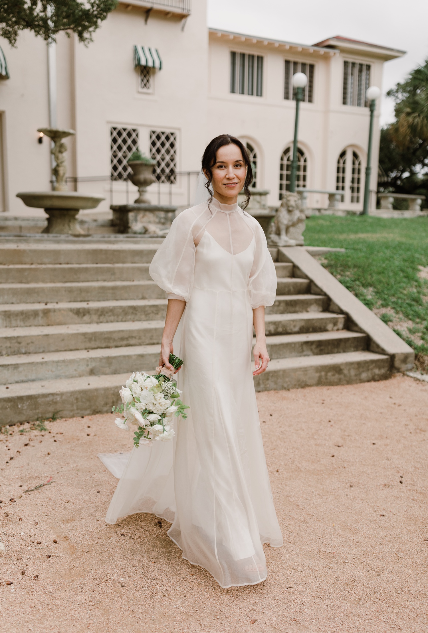 Bride wearing the Meiere Gown by Kamperett for her Austin wedding