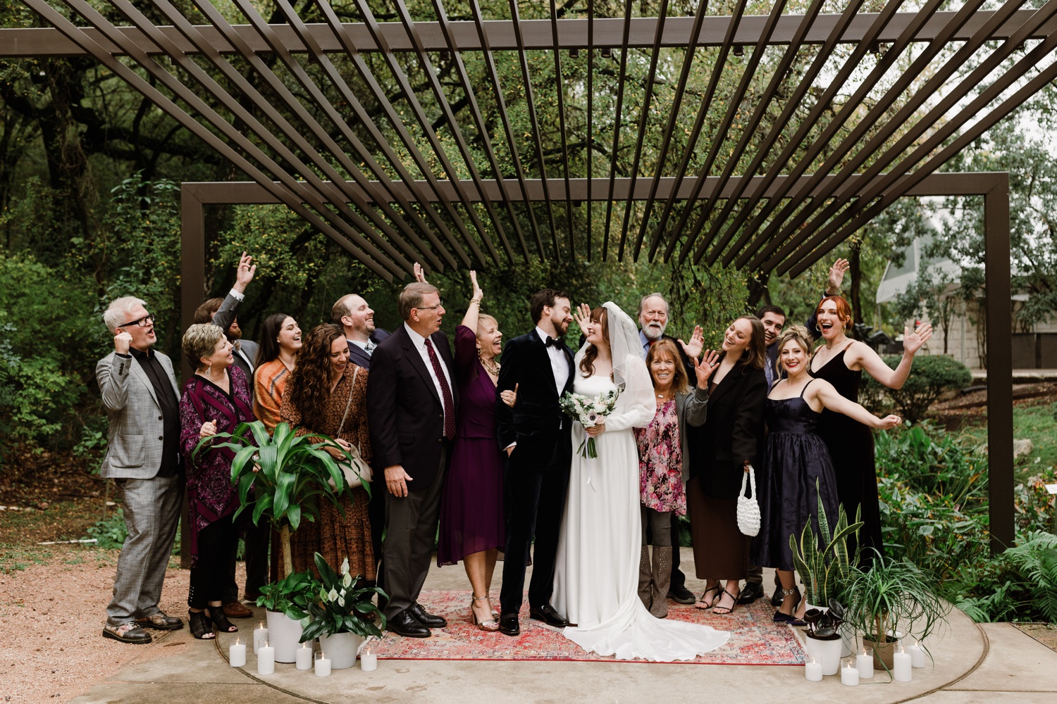 Candid wedding family portrait at UMLAUF Sculpture Garden