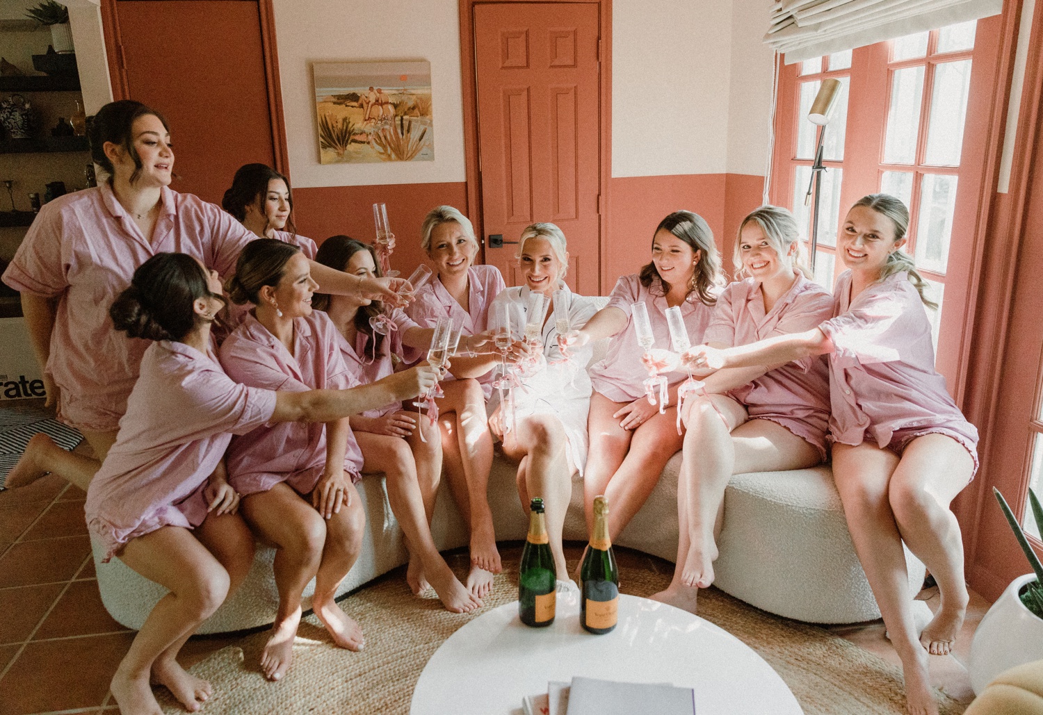 Bridesmaids toasting while getting ready for a Houston wedding