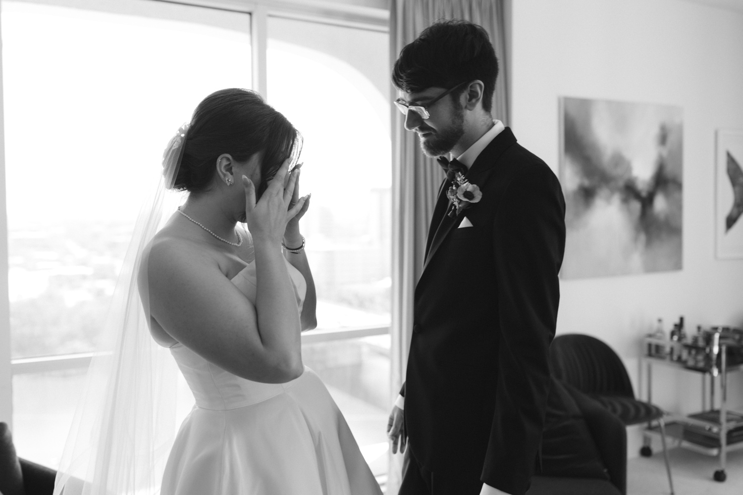 Wedding first look inside a suite at the LINE Hotel in Austin