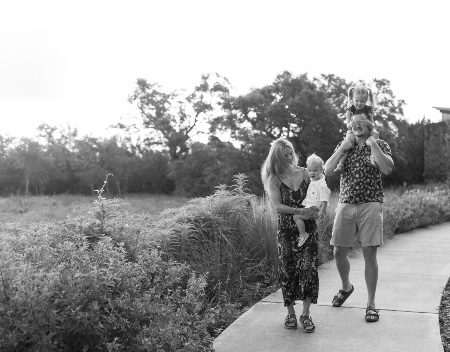 Family of four on a walk at the Lady Bird Johnson Wildflower Center