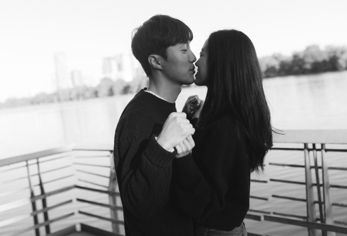 A documentary-style film photos of a couple on Lady Bird Lake boardwalk 