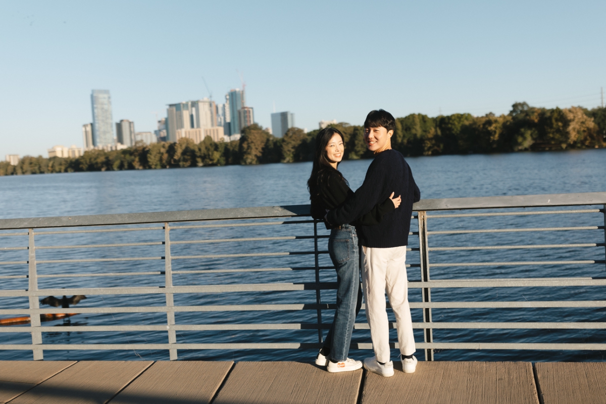 Couple's engagement session at Lady Bird Lake with the Austin skyline in the background