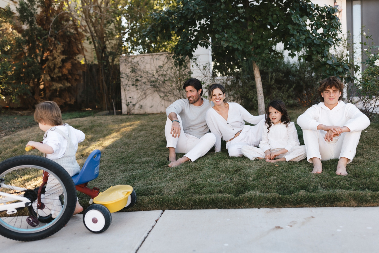 family playing outside during their at-home session