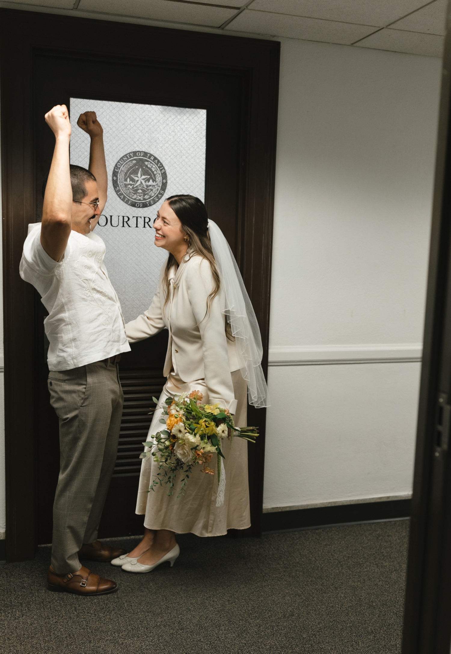 couple celebrating after courthouse elopement in Austin