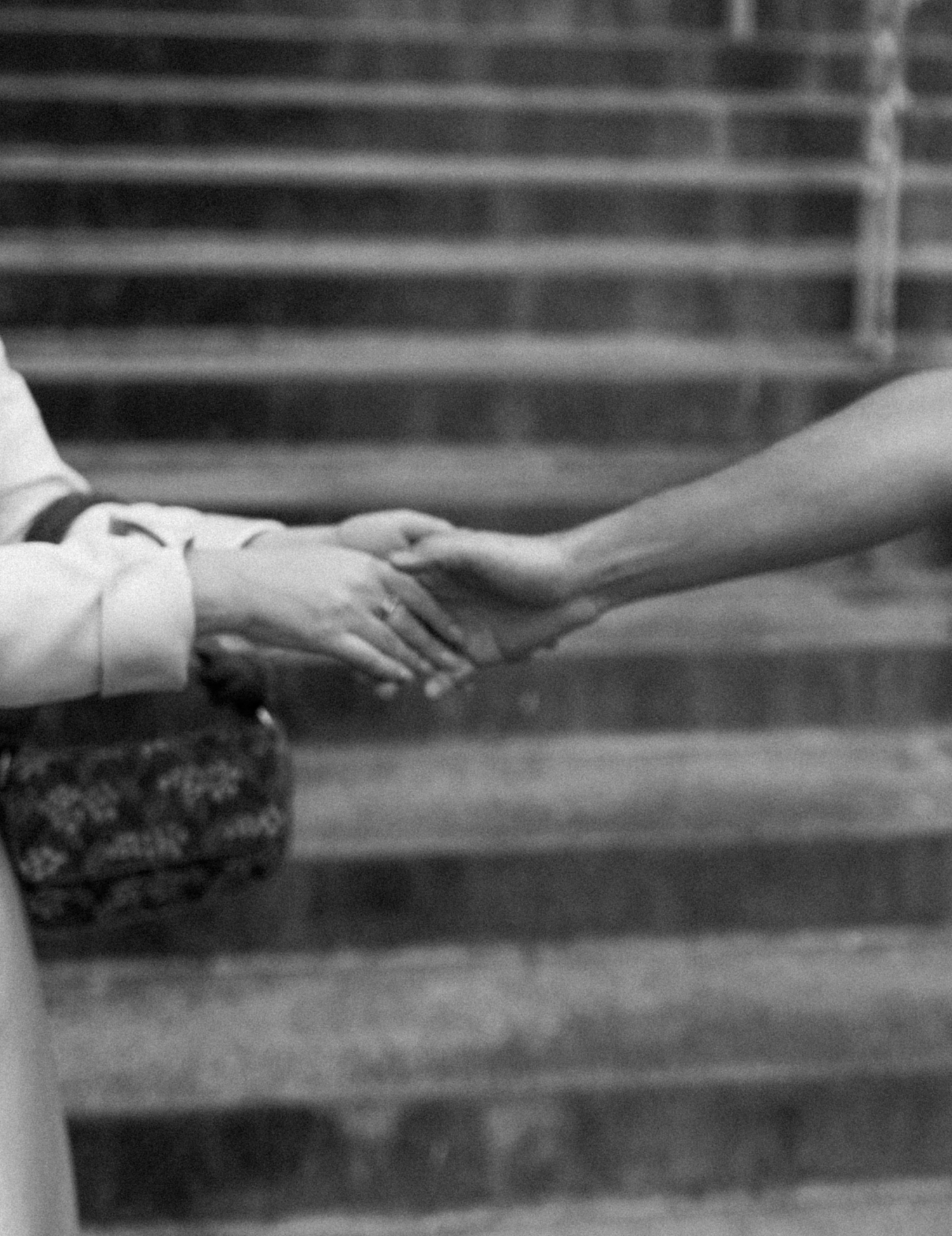 close up of bride and groom's hands