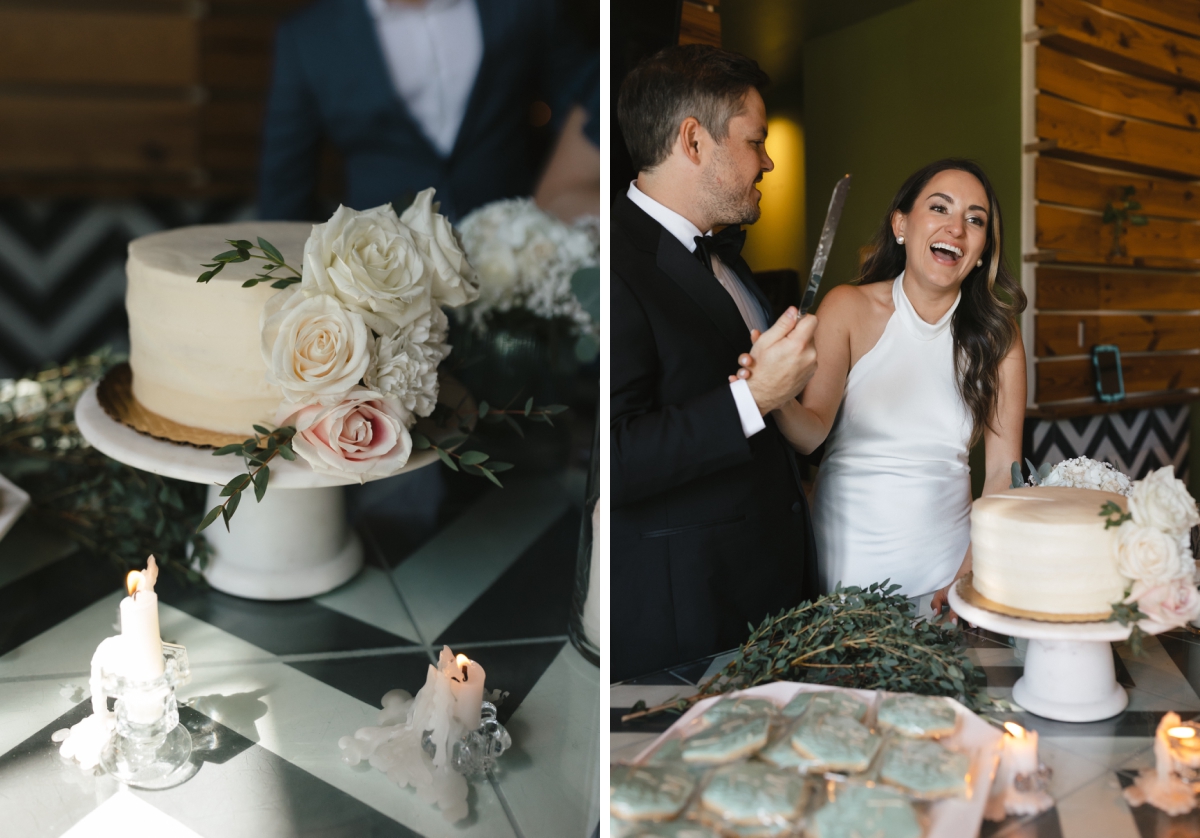 The bride and groom cut a small, white, one-tier wedding cake decorated with white and pink roses