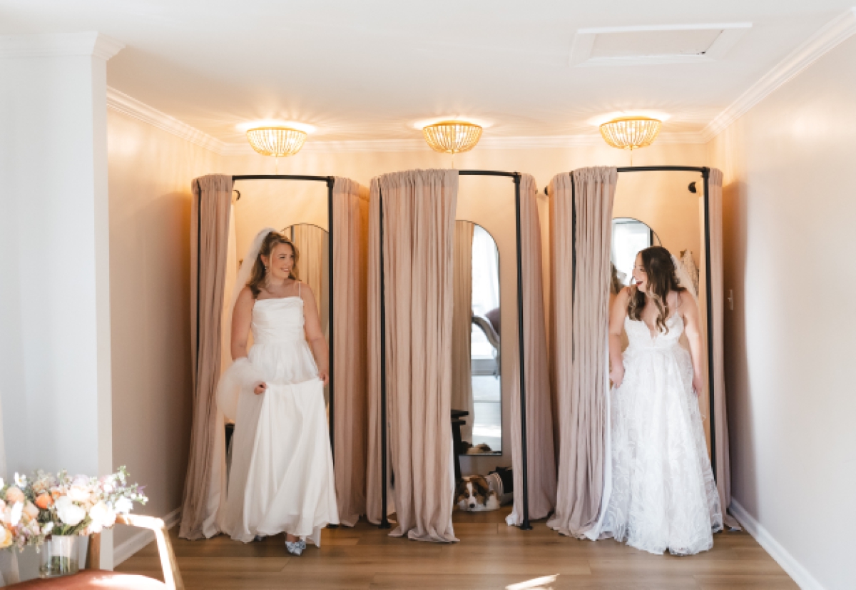 Brides exit the dressing rooms at The Addison Grove's cottage and see one another in their bridal gowns for the first time