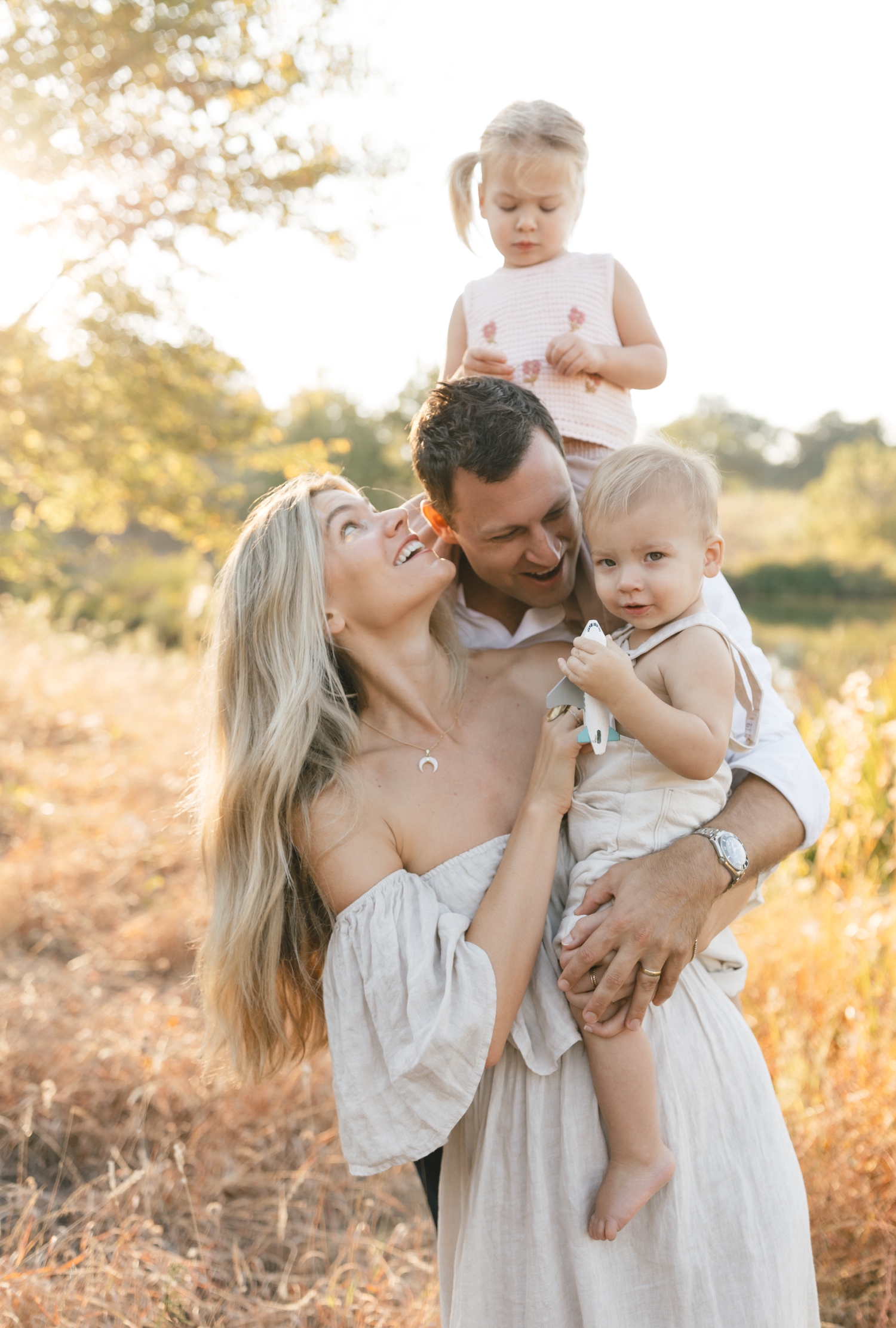 A golden hour portrait of a family at the Southwest Greenway in Austin, Texas