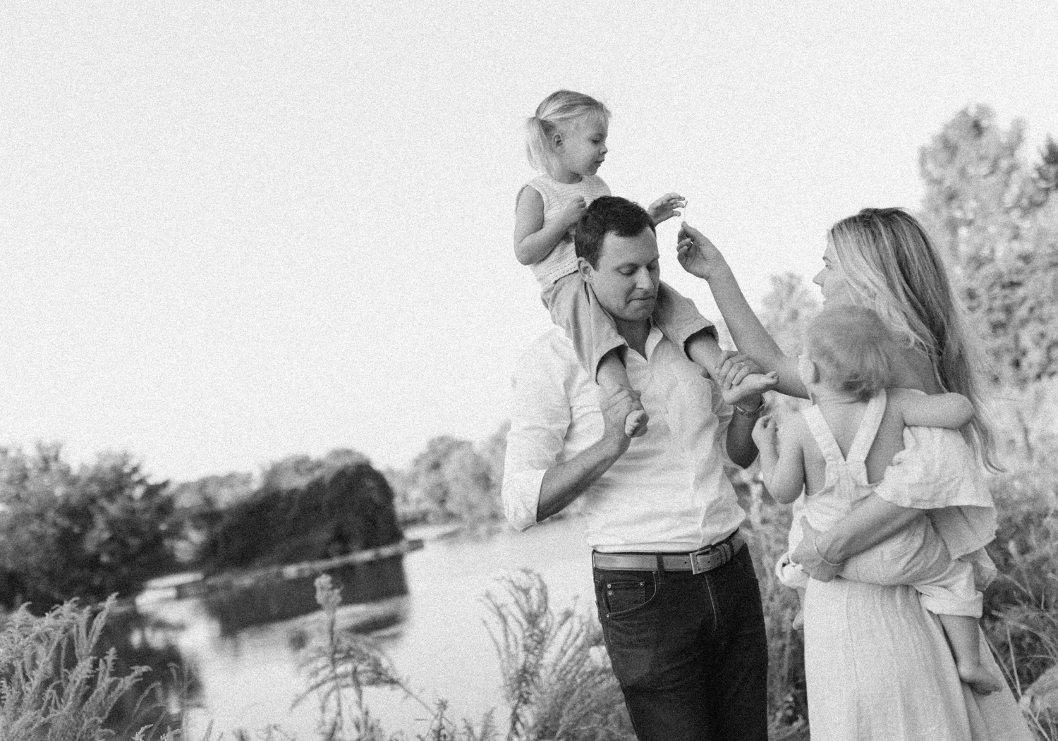 Natural family photos in black and white at the Southwest Greenway in Austin, Texas