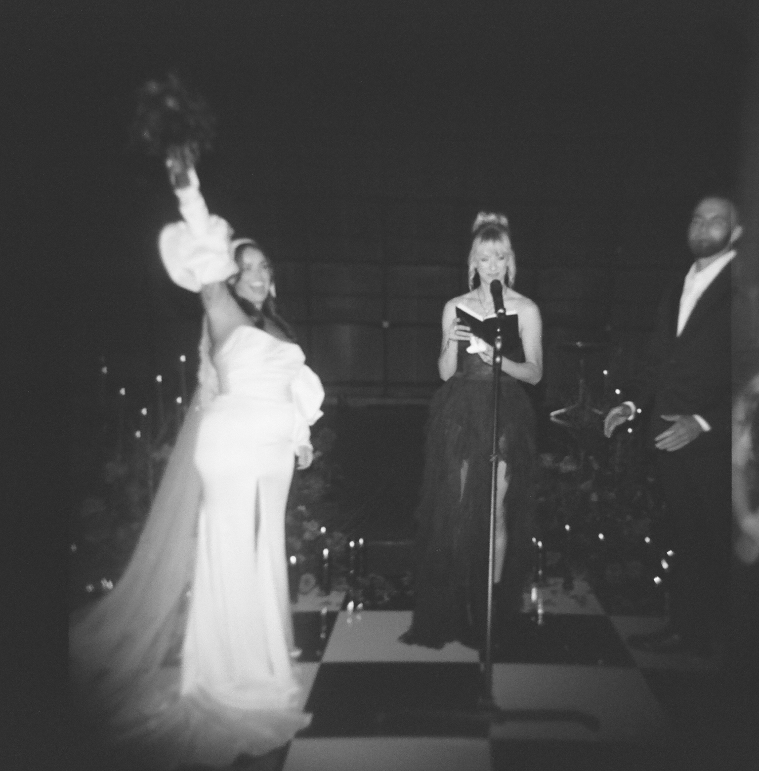 A film photo of a bride celebrating after her wedding ceremony