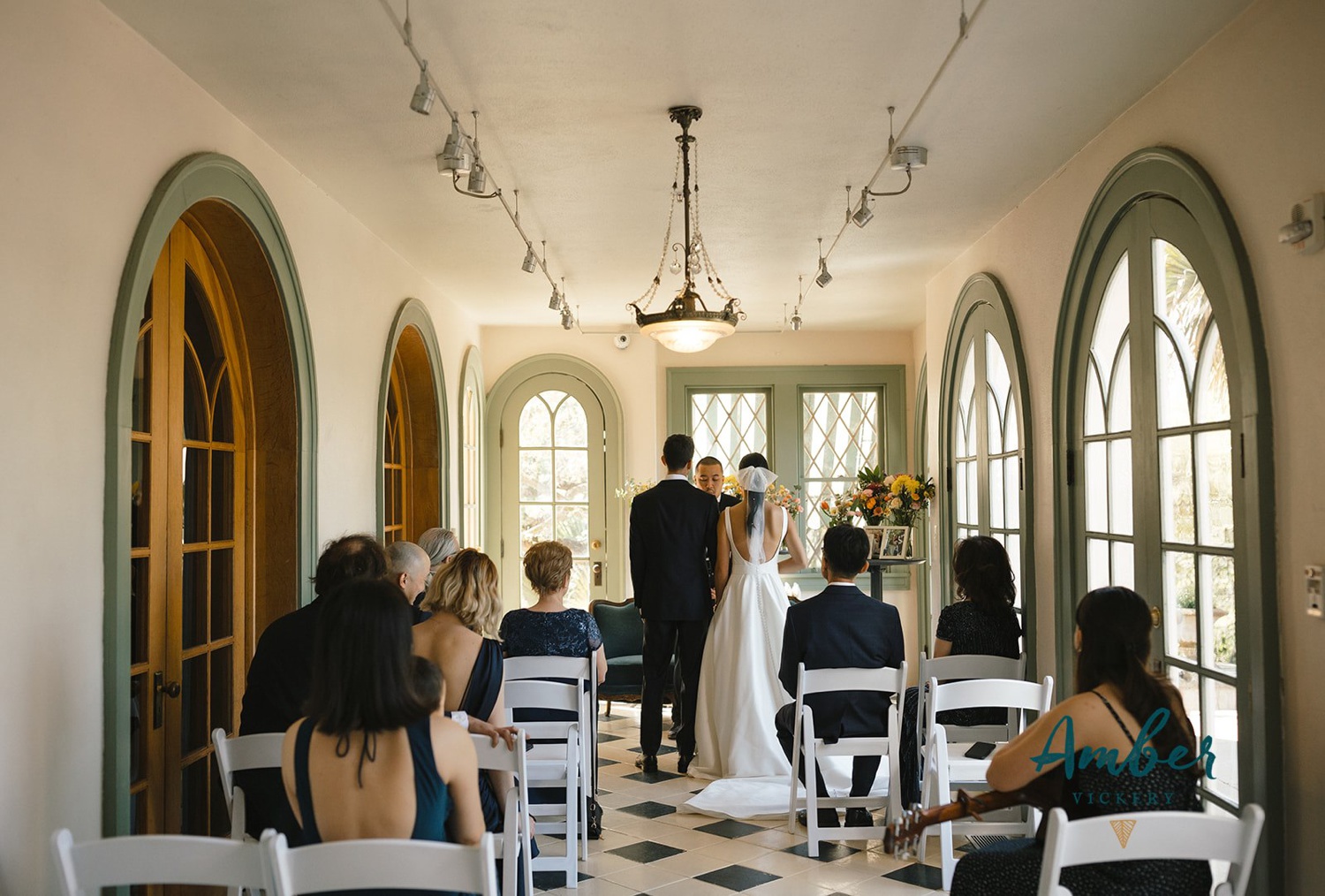 Intimate wedding ceremony in the sunroom at Laguna Gloria in Austin