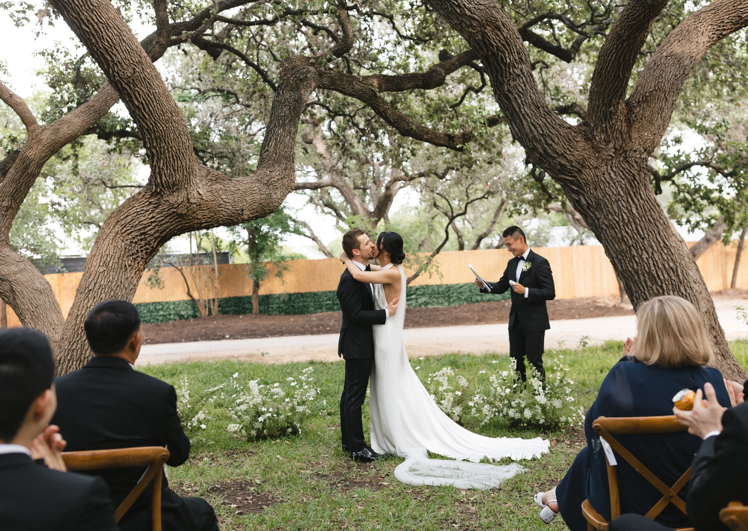 Bride and groom kissing at their Austin wedding ceremony