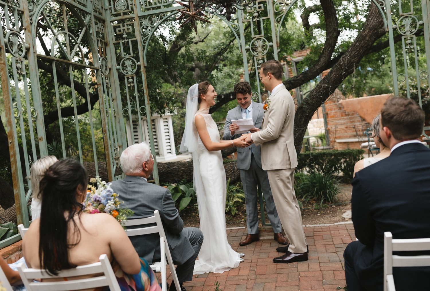 Intimate wedding ceremony in an iron gazebo