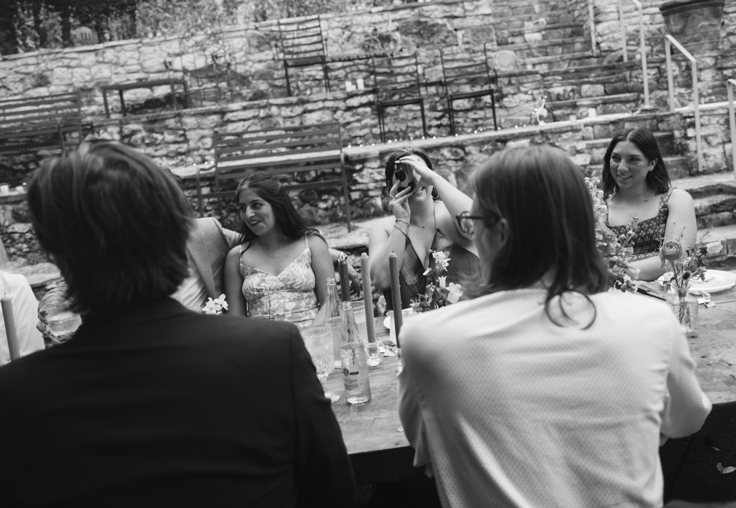 Wedding guest taking a picture with a Polaroid camera 