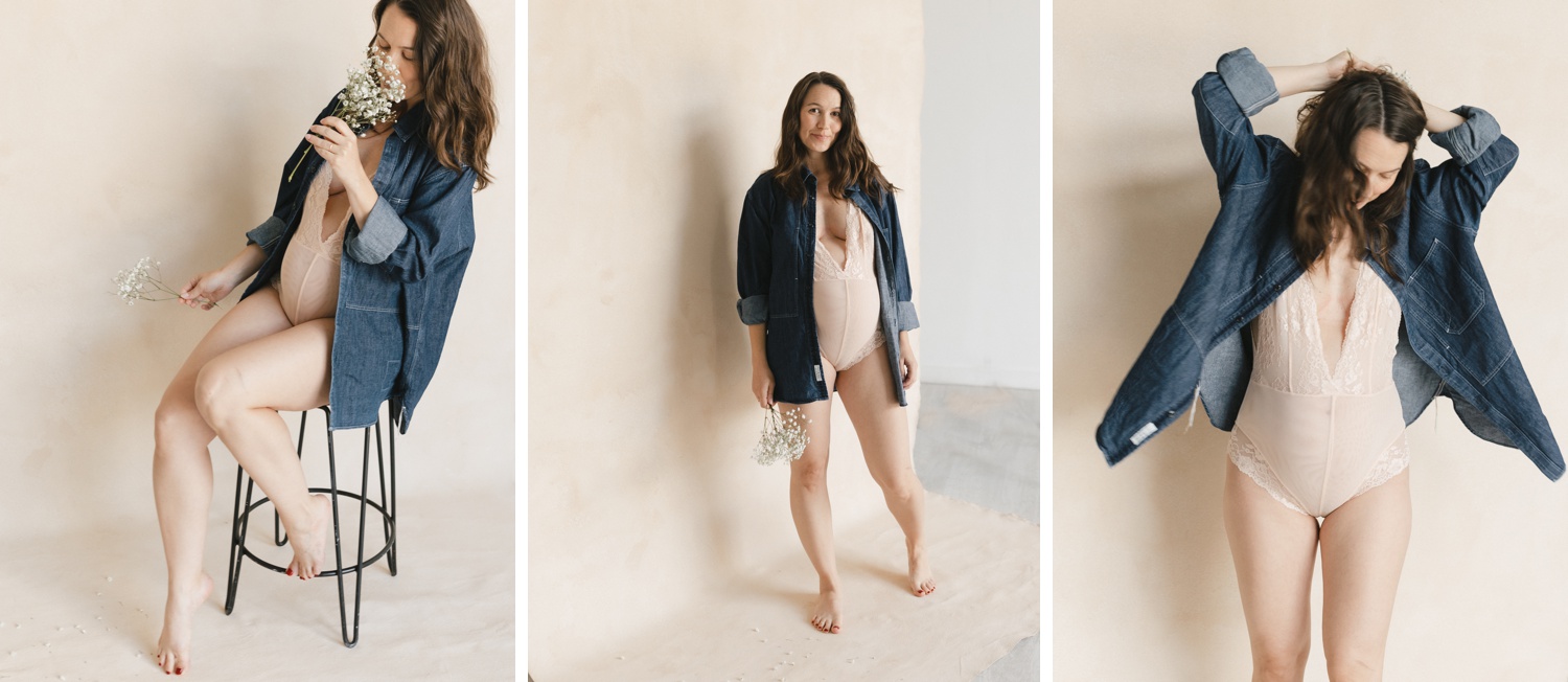 Pregnant mother posing in front of a blush studio backdrop for her maternity session