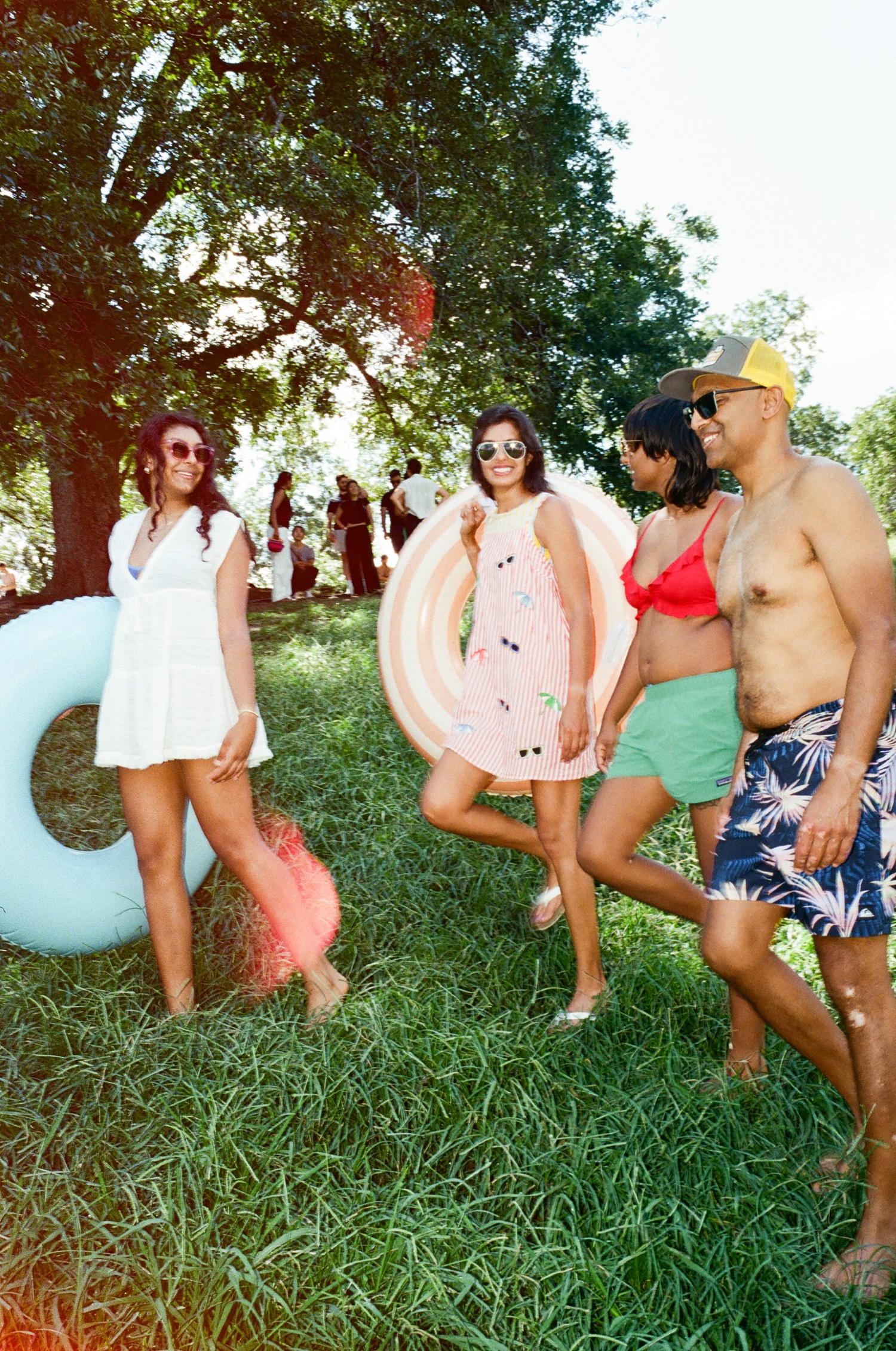 Family carrying inner tubes at Barton Springs